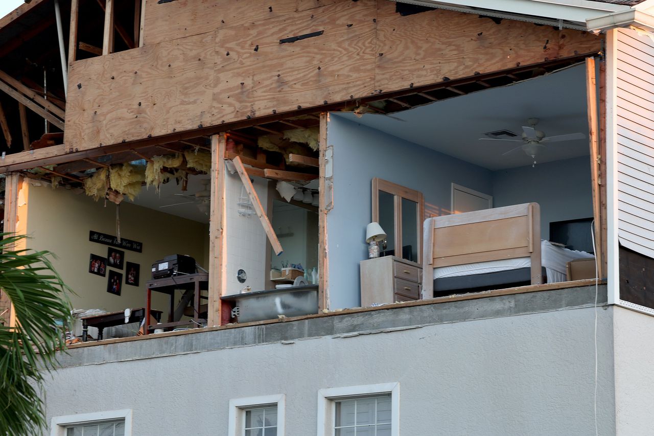 A wall of this condo was torn off as hurricane Ian passed through Fort Myers.