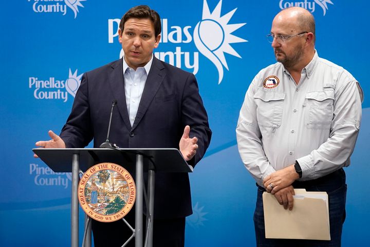 Florida Gov. Ron DeSantis, left, speaks as he stands with Kevin Guthrie, director of the Florida Division of Emergency Management, during a news conference on Sept. 26 in Largo, Florida.