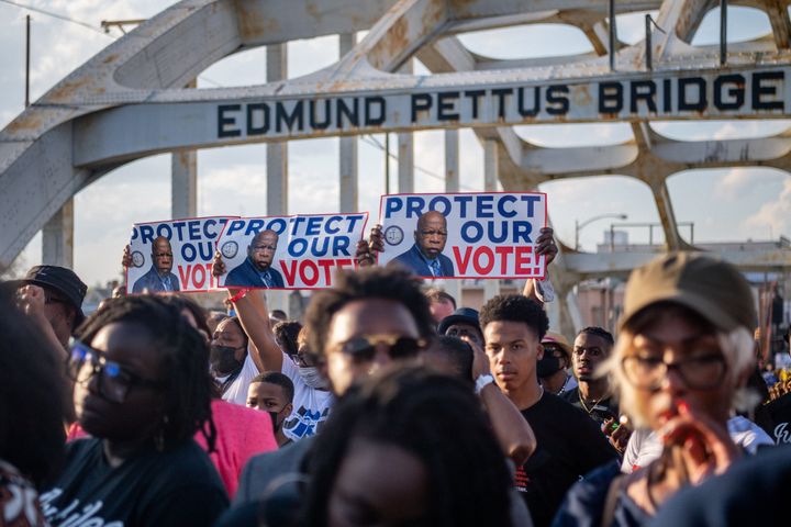 People march across the Edmund Pettus Bridge during commemorations for the 57th anniversary of "Bloody Sunday" on March 6 in Selma, Alabama.