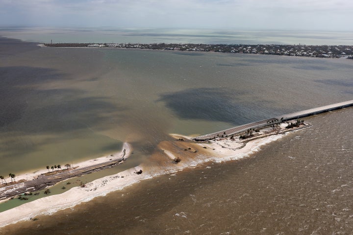 In this aerial view, parts of Sanibel Causeway are washed away along with sections of the bridge after Hurricane Ian passed through the area on Sept. 29 in Sanibel, Florida. 