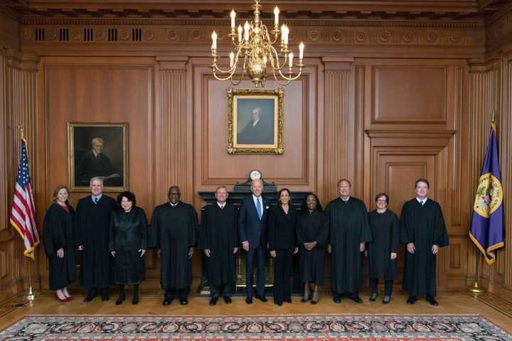 WASHINGTON, DC - SEPTEMBER 30: In this handout provided by the Collection of the Supreme Court of the United States, Members of the Supreme Court with the President (L-R) Associate Justices Amy Coney Barrett, Neil M. Gorsuch, Sonia Sotomayor, and Clarence Thomas, Chief Justice John G. Roberts, Jr., President Joseph R. Biden, Jr., Vice President Kamala Harris, and Associate Justices Ketanji Brown Jackson, Samuel A. Alito, Jr., Elena Kagan, and Brett M. Kavanaugh pose at a courtesy visit in the Justices Conference Room prior to the investiture ceremony of Associate Justice Ketanji Brown Jackson September 30, 2022 in Washington, DC. President Joseph R. Biden, Jr., First Lady Dr. Jill Biden, Vice President Kamala Harris, and Second Gentleman Douglas Emhoff attended as guests of the Court. On June 30, 2022, Justice Jackson took the oaths of office to become the 104th Associate Justice of the Supreme Court of the United States. (Photo by Collection of the Supreme Court of the United States via Getty Images)