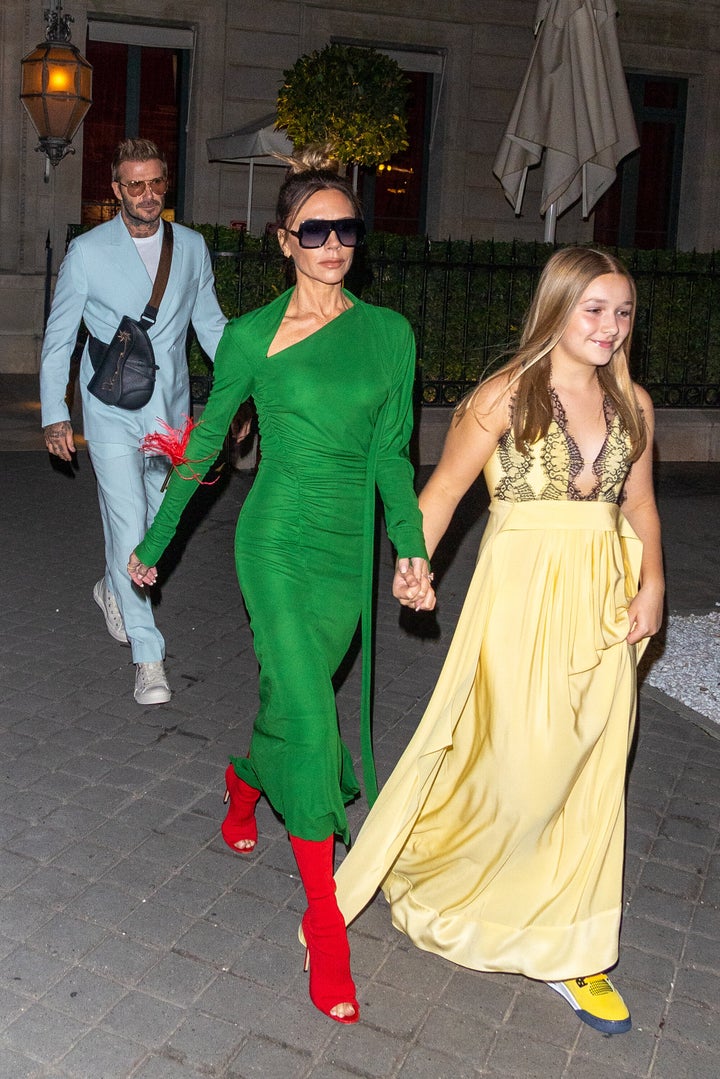 (L-R) David Beckham, Victoria Beckham and Harper Beckham are seen on September 30, 2022 in Paris, France. (Photo by Marc Piasecki/GC Images)