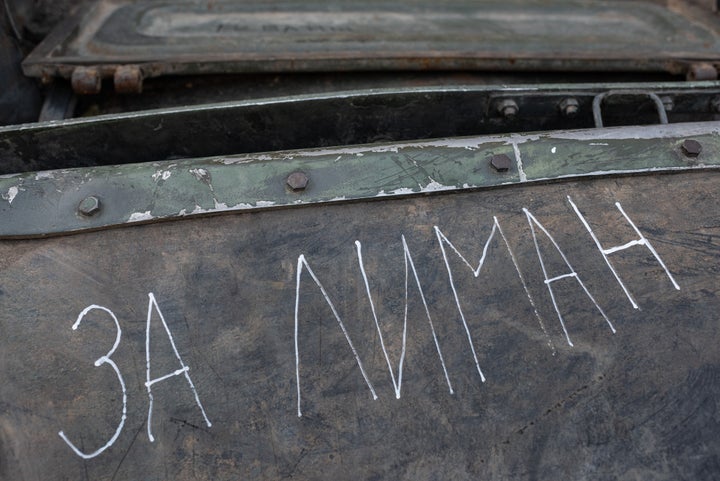 A hand written sign reads "For Lyman" and other writings are seen on a burnt-out Russian military vehicle displayed in the downtown area on August 22, 2022 in Kyiv, Ukraine.