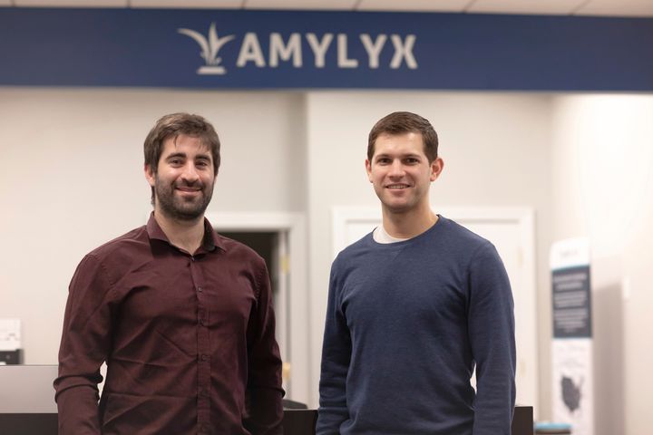 This 2018 photo provided by Amylyx shows the company's co-founders Joshua Cohen, left, and Justin Klee in Cambridge, Massachusetts. 