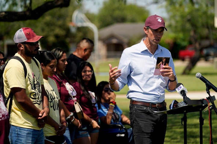 After taking a five-hour bus trip, family of the Uvalde shooting massacre stand with Texas Democratic gubernatorial candidate Beto O'Rourke, right, during a pre-campaign debate news conference, Friday, Sept. 30, 2022, in Edinburg, Texas. O'Rourke will face Gov. Greg Abbott in a debate Friday evening.