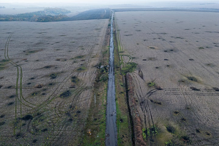 Artillery craters are seen in the field from an arial view in the recently liberated area of Kharkiv region, Ukraine, Friday, Sept. 30, 2022.