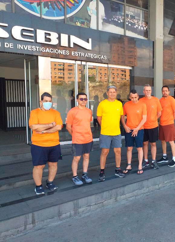 This undated photo posted to Twitter in June 2020 by Venezuelan Foreign Minister Jorge Arreaza shows CITGO oil executives, from left to right, Jose Angel Pereira, Gustavo Cardenas, Jorge Toledo, Jose Luis Zambrano, Tomeu Vadell and Alirio Jose Zambrano, standing outside the Bolivarian National Intelligence Service, in Caracas.