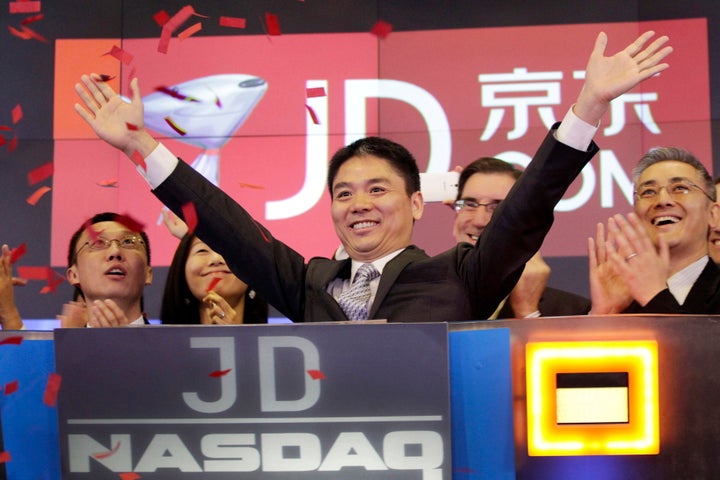 Liu Qiangdong, also known as Richard Liu, CEO of JD.com, raises his arms to celebrate the IPO for his company at the Nasdaq MarketSite, in New York on May 22, 2014. The Chinese billionaire and one of the richest men in the world went to trial in Minneapolis on Sept. 29, 2022, to defend himself against allegations that he raped a former University of Minnesota student after a night of dinner and drinks in 2018.