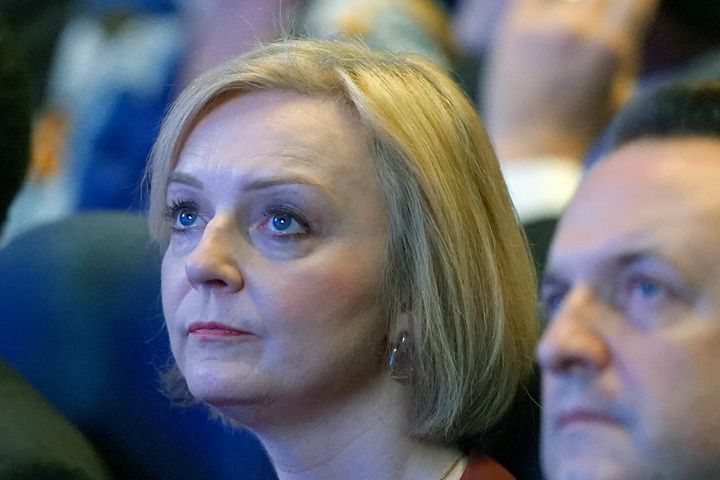 Liz Truss sits with her husband Hugh O'Leary during the Conservative Party annual conference in Birmingham. 