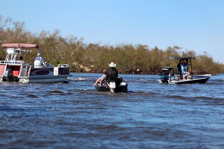 Residents are evacuated from the island by boats on Oct. 2, 2022 in Pine Island, Florida. Residents are being encouraged to leave because the only road onto the island is impassable and electricity and water remain knocked out after Hurricane Ian passed through the area. 