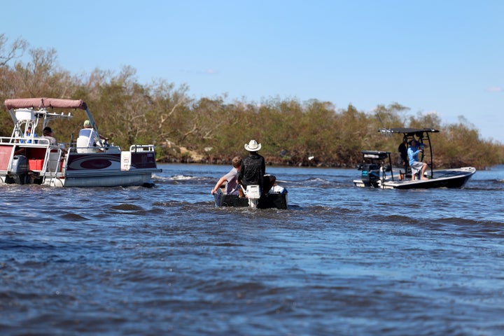 Residents are evacuated from the island by boats on Oct. 2, 2022 in Pine Island, Florida. Residents are being encouraged to leave because the only road onto the island is impassable and electricity and water remain knocked out after Hurricane Ian passed through the area. 