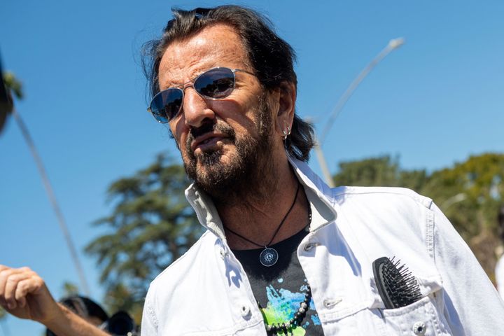 Ringo Starr, pictured in July, is recovering at home, according to a statement.