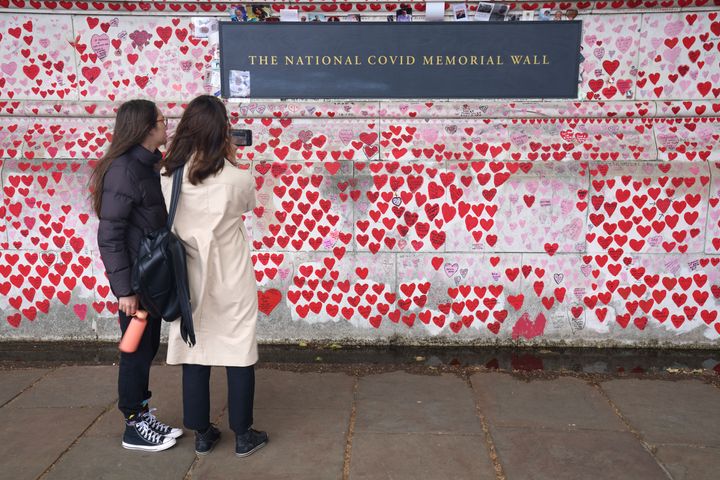 Visitors to the National Covid Memorial Wall in London