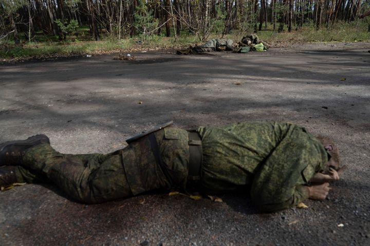 Dead bodies of Russian servicemen lie on the ground in the recently recaptured town of Lyman, Ukraine, on Oct. 3, 2022. 