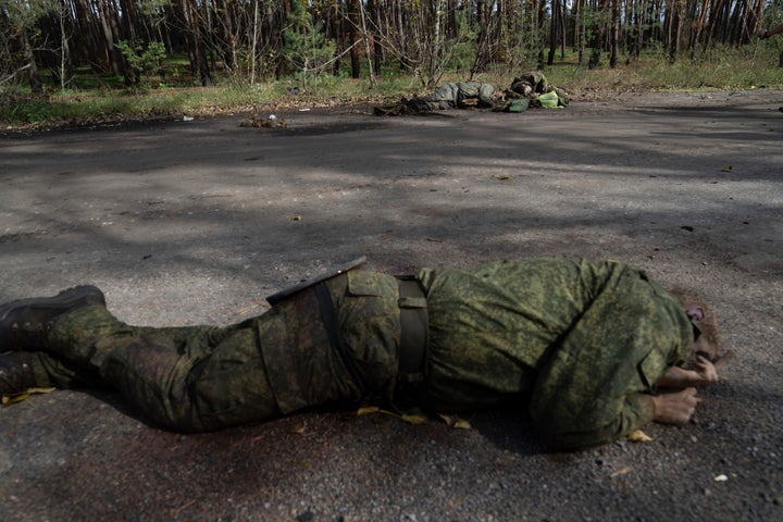 Dead bodies of Russian servicemen lie on the ground in the recently recaptured town of Lyman, Ukraine, on Oct. 3, 2022.