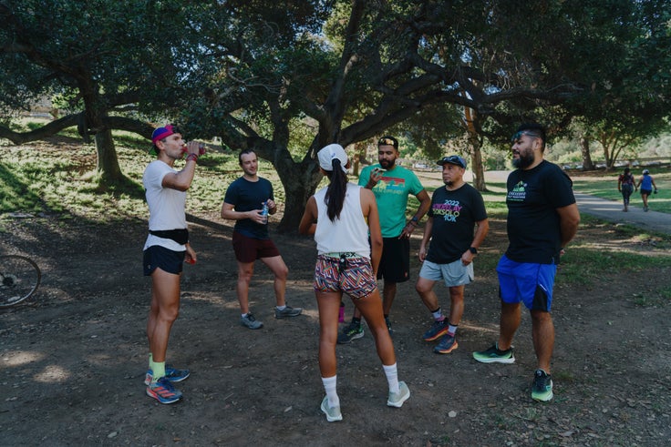 The team congregates for snacks and socializing after their run at Griffith Park.