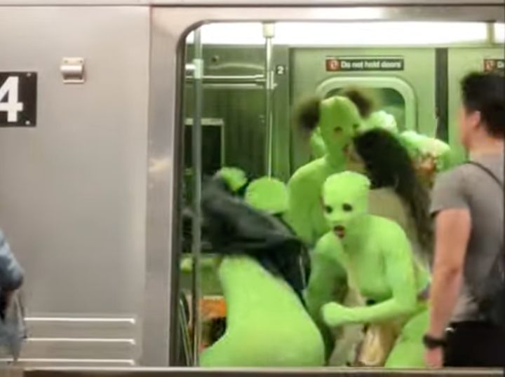 Six women in neon green leotards attacked two women on a New York subway on Sunday afternoon.