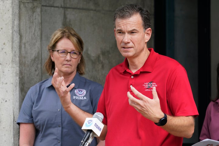 Jamie Rhome (right), the acting director of the National Hurricane Center, gives an update about Hurricane Ian on Sept. 26 in Miami.