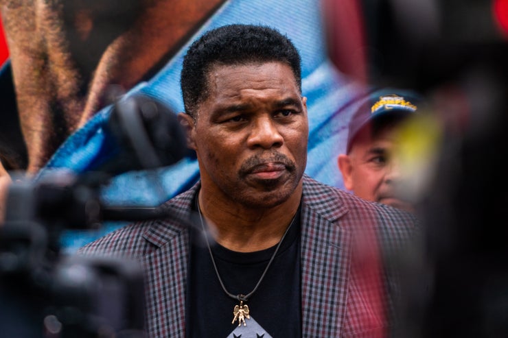 Republican Senate nominee Herschel Walker speaks to the news media following his Unite Georgia Bus Stop rally in Norcross, Georgia, on Sept. 9.