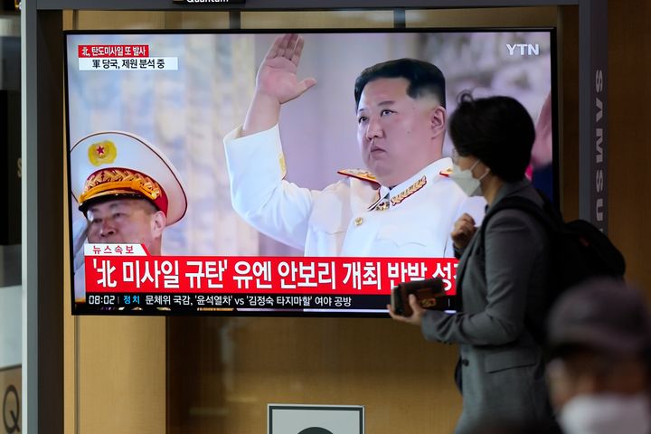 A TV screen showing a news program reporting about North Korea's missile launch with file footage of North Korean leader Kim Jong Un, is seen at the Seoul Railway Station in Seoul, South Korea, on Oct. 6, 2022. 