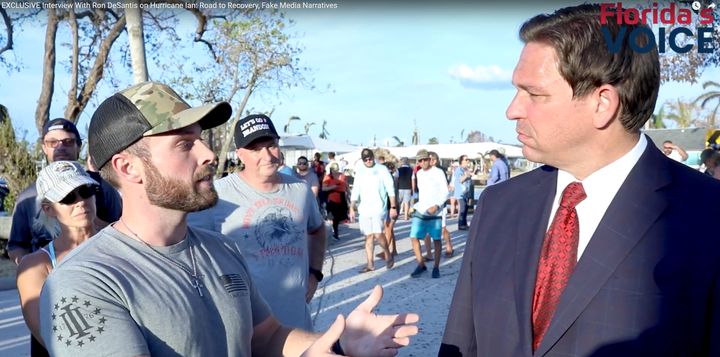 Florida Gov. Ron DeSantis (right) being interviewed by Brendon Leslie, founder of the far-right website Florida’s Voice.