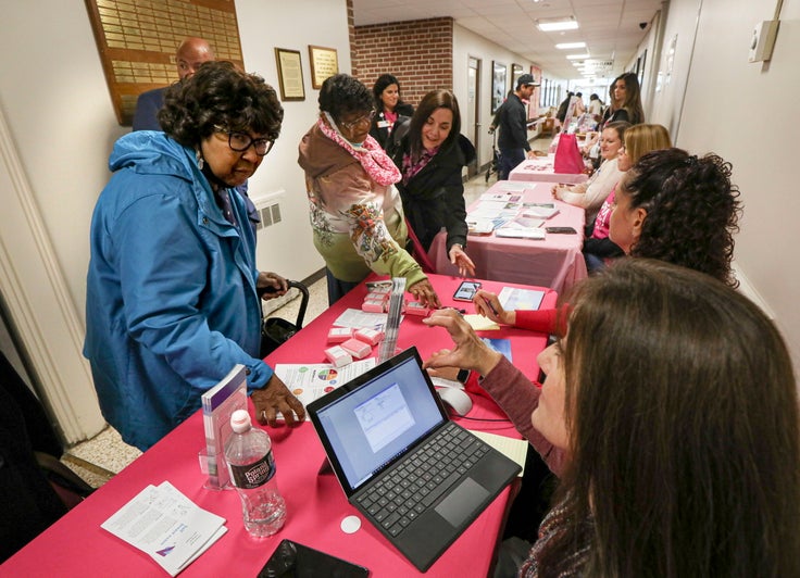 A woman signs up for a free mammogram during a health fair in Lindenhurst, New York, on Tuesday.