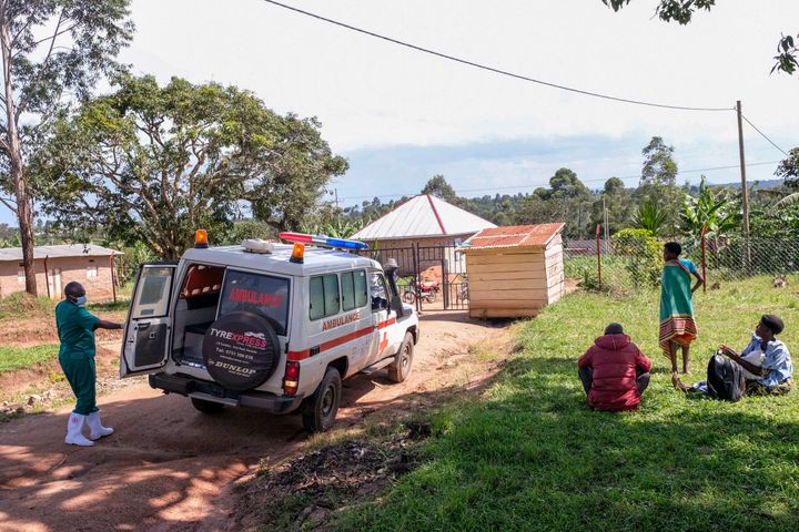 A medical officer from the Uganda Red Cross Society instructs people with suspected Ebola symptoms to enter an ambulance, in Madudu, near Mubende, in Uganda, Thursday, Sept. 29, 2022. (AP Photo/Hajarah Nalwadda)