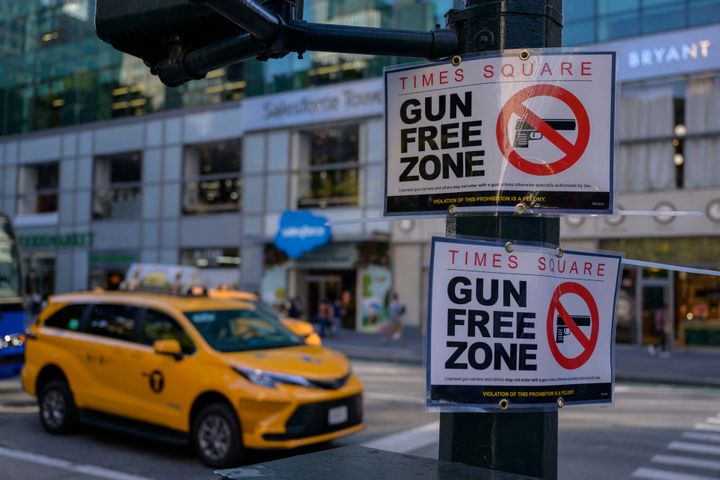 A "Gun Free Zone" sign is seen posted near Times Square in Manhattan on September 1, 2022 in New York. (Photo by ANGELA WEISS/AFP via Getty Images)