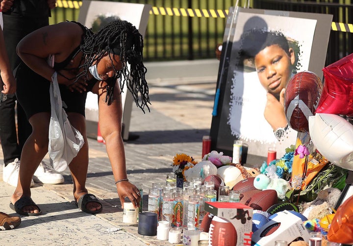 Family and friends of Tyre Sampson leave items during a vigil in front of the Orlando FreeFall drop tower on March 28.