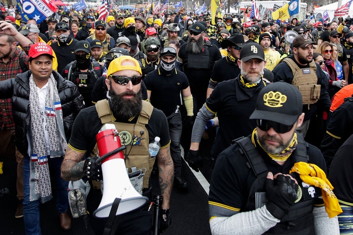 Far-right Proud Boys member Jeremy Joseph Bertino, second from left, joins other supporters of President Donald Trump who are wearing attire associated with the Proud Boys as they attend a rally at Freedom Plaza, Dec. 12, 2020, in Washington. Bertino pleaded guilty on Thursday, Oct. 6, 2022, to plotting with other members of the Proud Boys to violently stop the transfer of presidential power after the 2020 election, making him the first member of the extremist group to plead guilty to a seditious conspiracy charge. (AP Photo/Luis M. Alvarez, File)