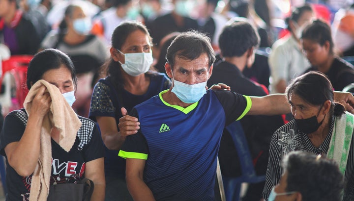 Friends hugged sobbing family members struggling with staggering loss Friday in a rural northeastern Thailand community mourning the children and other victims slain by a fired police officer in the nation’s deadliest shooting rampage.