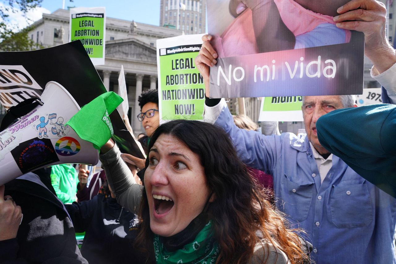 A New York City demonstrator yells at anti-abortion protestors.
