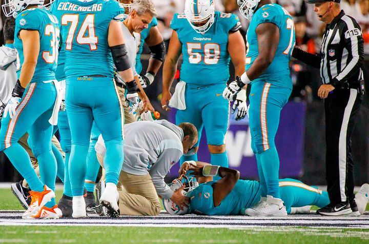 Miami Dolphins quarterback Tua Tagovailoa (1) is attended by medical staff after being sacked by Cincinnati Bengals defensive tackle Josh Tupou during the second quarter of an NFL football game at Paycor Stadium on Thursday, Sept. 29, 2022, in Cincinnati, Ohio. (David Santiago/Miami Herald/Tribune News Service via Getty Images)