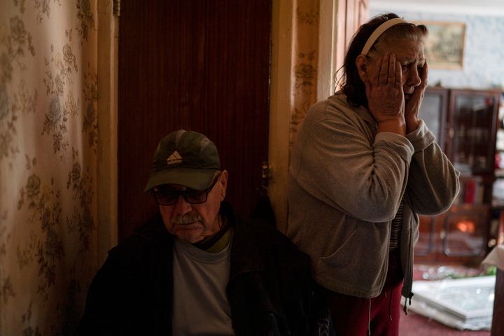 Tetyana Lazunko stands next to her husband, Oleksii Lazunko, 75, in their apartment that was damaged after a Russian attack at a residential area in Zaporizhzhia, Ukraine, Sunday, Oct. 9, 2022. There was an explosion "everything was flying and I was shouting", explained the 73-year-old woman. She says that in the area there is nothing, no industries, no militaries or military factories. (AP Photo/Leo Correa)