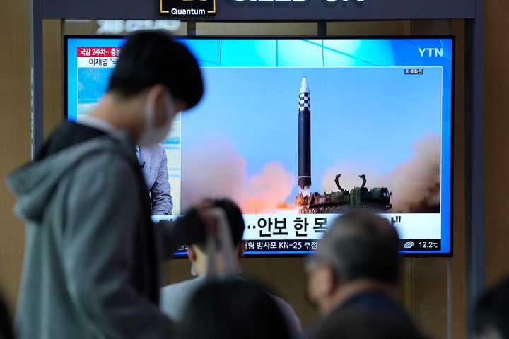 A TV screen showing a news program reporting about North Korea's missile launch with file footage, is seen at the Seoul Railway Station in Seoul, South Korea, Sunday, Oct. 9, 2022. North Korea fired two short-range ballistic missiles toward its eastern waters on Sunday, the latest of a recent barrage of weapons tests, a day after it warned the redeployment of a U.S. aircraft carrier near the Korean Peninsula was inflaming regional tensions. (AP Photo/Lee Jin-man)