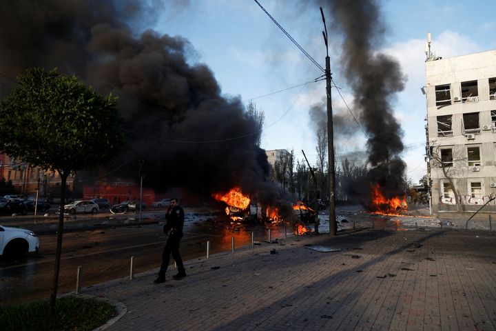 Cars are seen on fire after Russian missile strikes in Kyiv, Ukraine October 10.