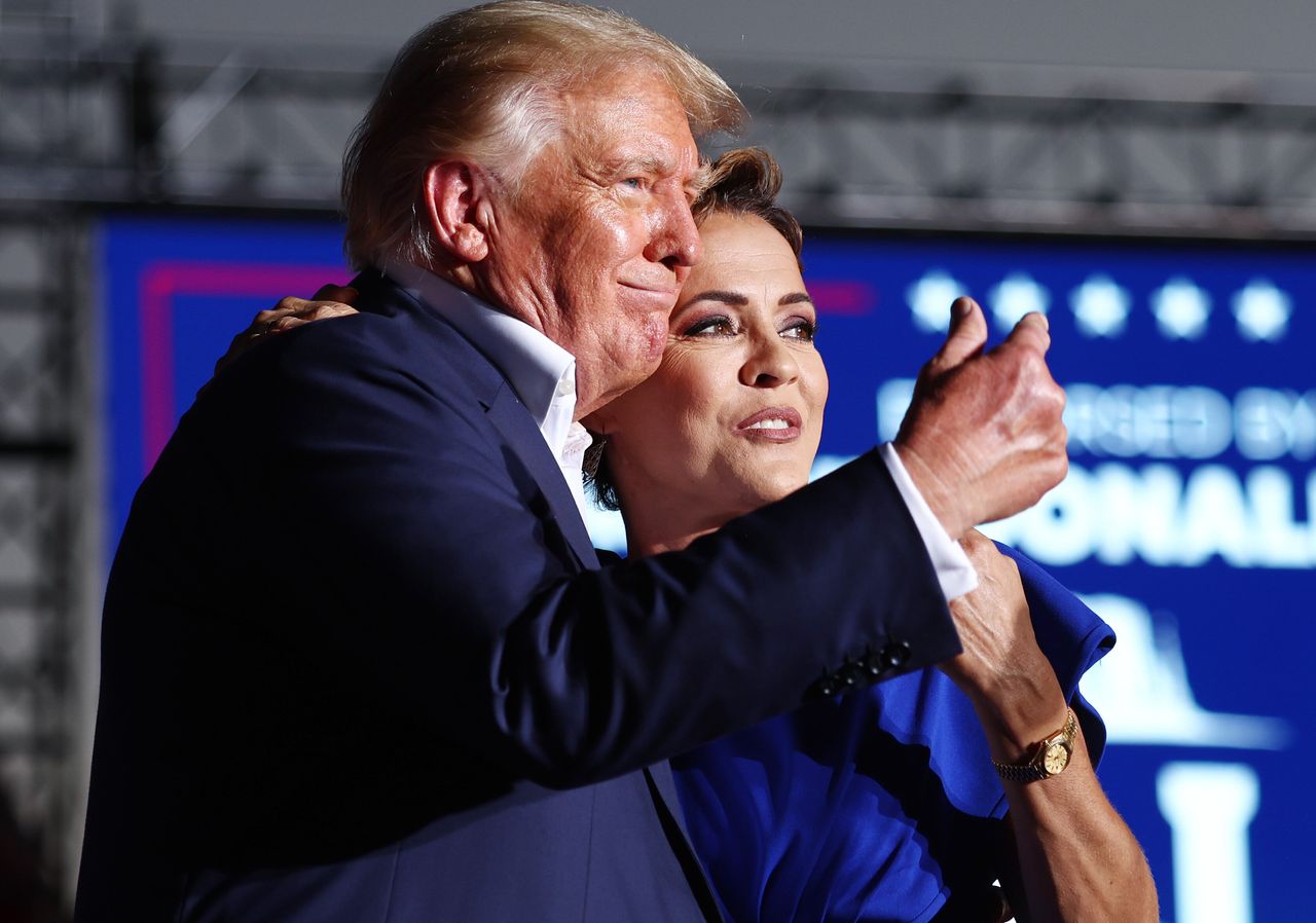 Former President Donald Trump embraces Arizona Republican gubernatorial nominee Kari Lake at a campaign rally at Legacy Sports USA on Sunday in Mesa, Arizona. Trump was stumping for Arizona GOP candidates ahead of the midterm election on Nov. 8.