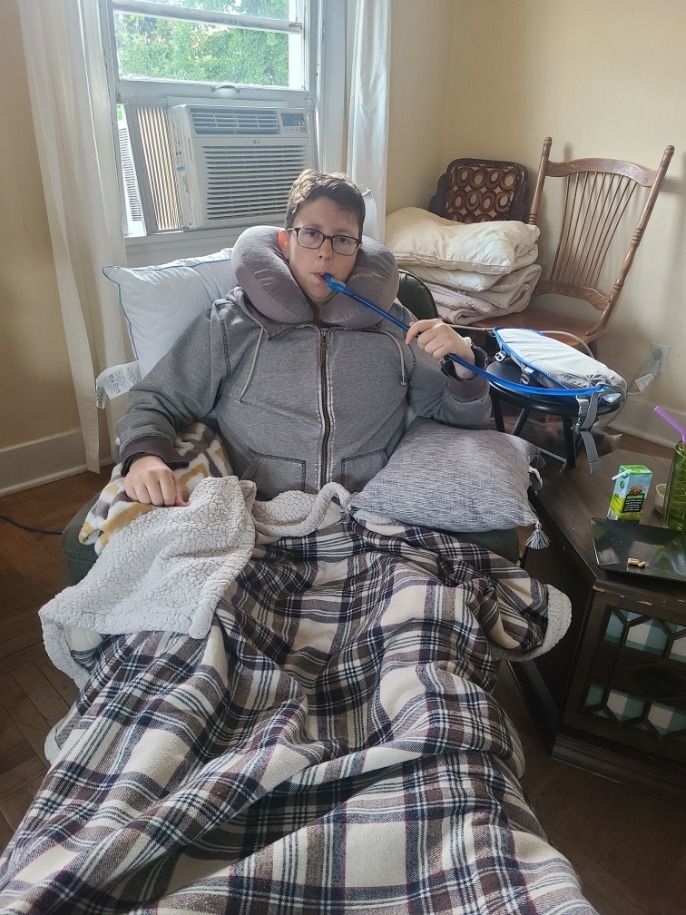 The author recovering at home after their top surgery.