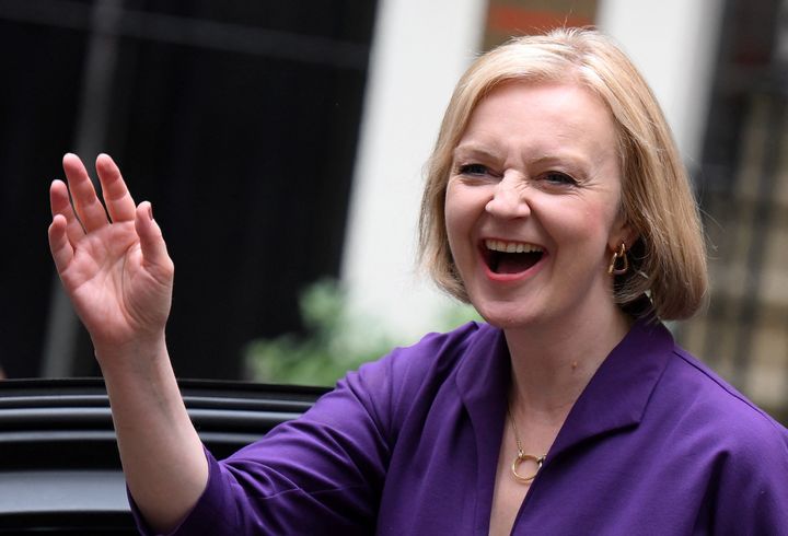 Liz Truss smiles and waves after being declared the winner of the Tory leadership contest last month.