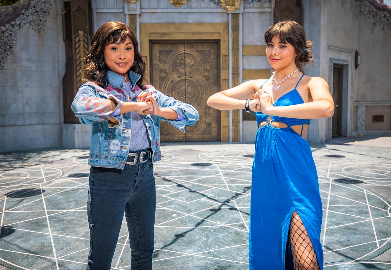 Actor Xochitl Gomez, right, poses with her comic counterpart, America Chavez, left, during a visit to Avengers Campus at Disney's California Adventure Park.