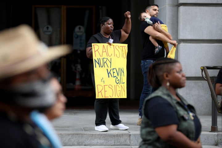 Latora Green and others protest in front of Los Angeles City Hall on Oct. 11, 2022, calling for the resignation of Los Angeles City Councilmembers Nury Martinez, Kevin de León and Gil Cedillo.