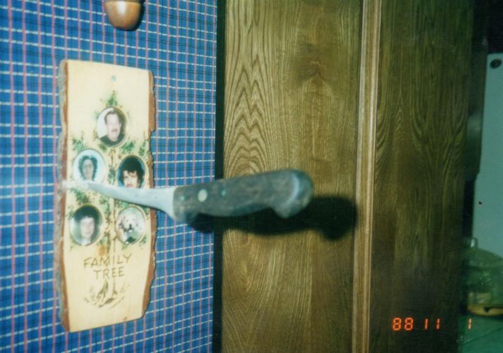 "A knife had been thrust into my grandmother’s portrait in our family picture frame in the hallway," the author writes of this photo from Nov. 1, 1988.