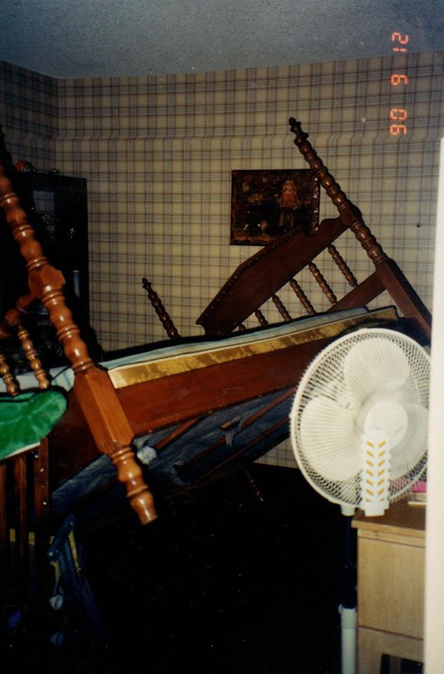 "After hearing loud noises from the guest bedroom, my mother opened the door and discovered the bed in this position," the author writes of this photo from Sept. 12, 1990.