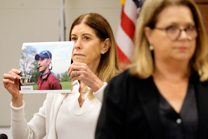 Linda Beigel Schulman holds a photograph of her son, Scott Beigel, before giving her victim impact statement during the penalty phase of Cruz's trial in August.