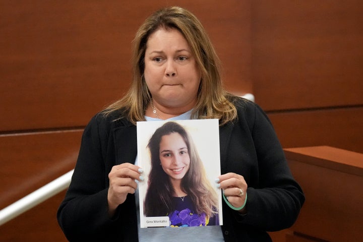 Jennifer Montalto holds a picture of her daughter, Gina, before giving her victim impact statement during the penalty phase last August.