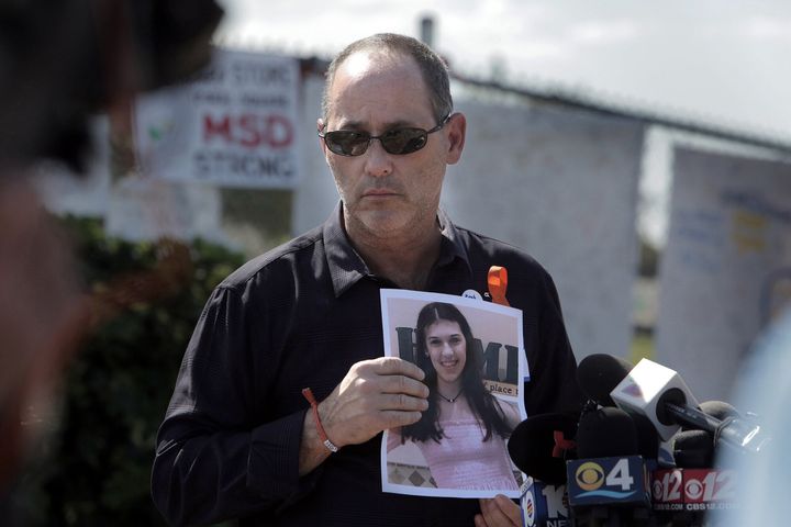 Fred Guttenberg holds a picture of his slain daughter, Jaime, a month after the 14-year-old was killed in the 2018 shooting.