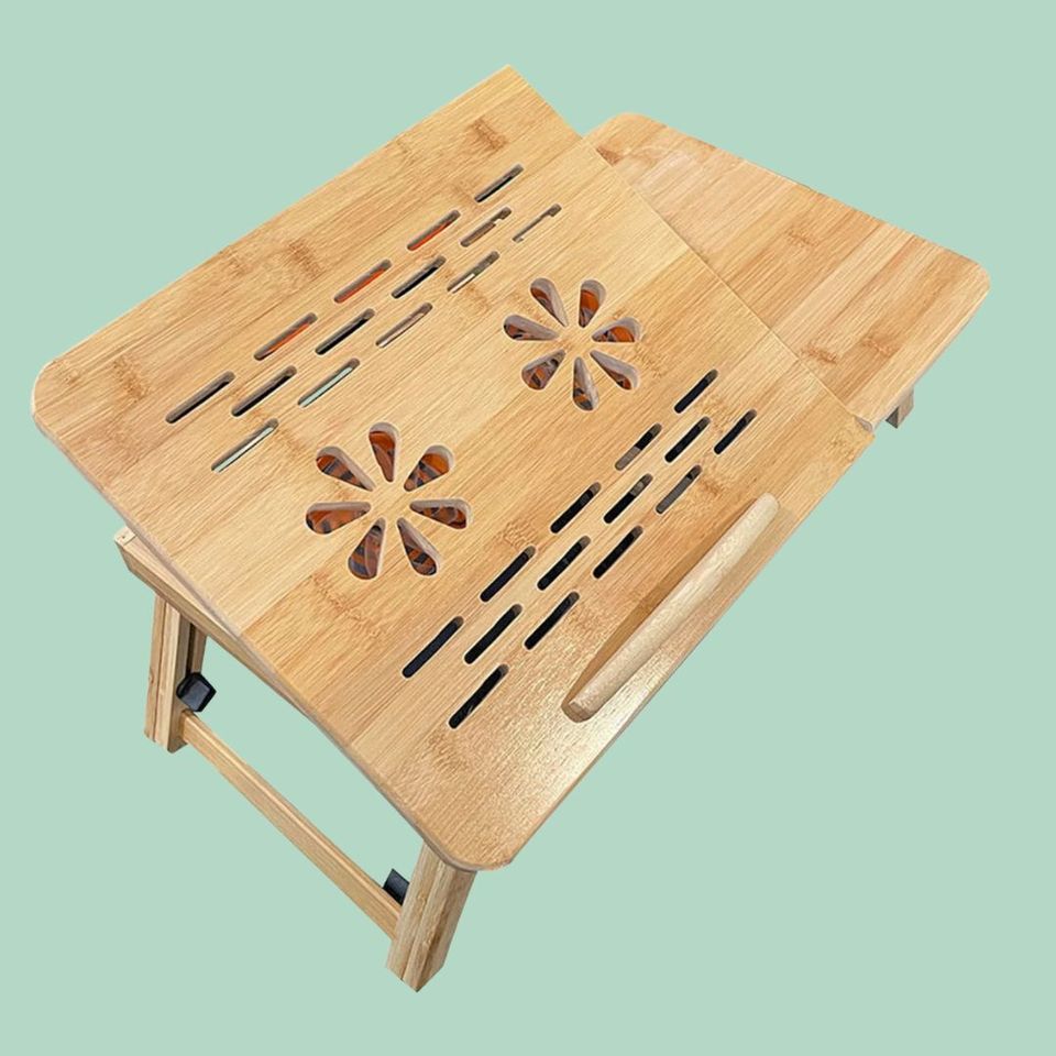 An adjustable table with built in desk fans