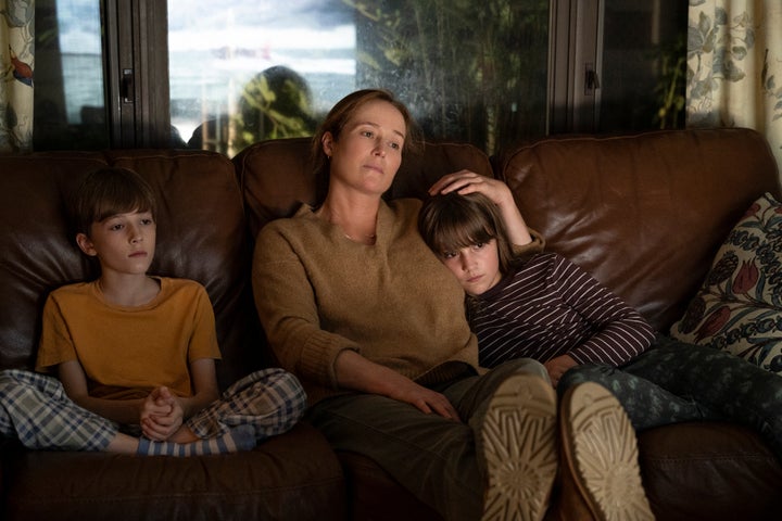 Wesley Holloway as Hywel Madden (left), Jennifer Ehle as Lauren Madden, and Justine Colan as Iris Madden in "She Said."