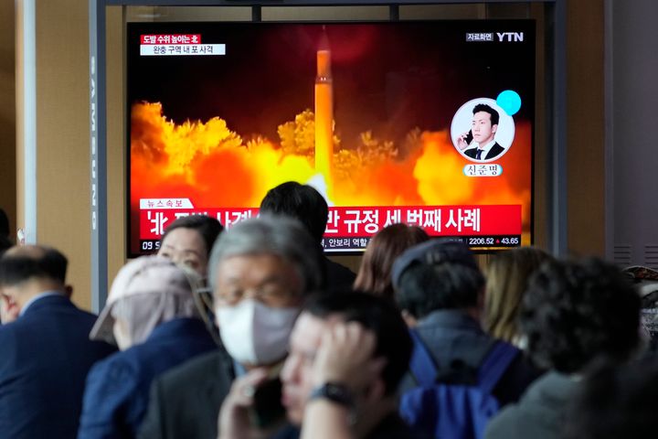 A TV screen shows a file image of North Korea's missile launch during a news program at the Seoul Railway Station in South Korea on Friday. North Korea launched a short-range ballistic missile toward its eastern waters early Friday and flew warplanes near the border with South Korea, further raising animosities triggered by the North's recent barrage of weapons tests.