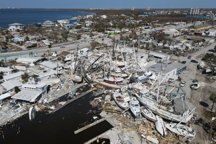 Shrimp boats lie grounded atop what was a San Carlos Island mobile home park in Fort Myers Beach, Florida on Friday.